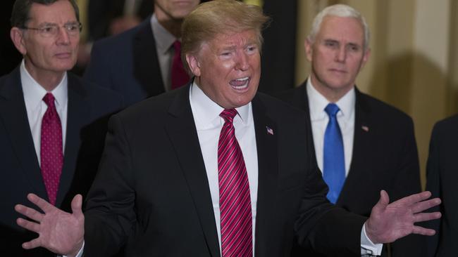 Sen. John Barrasso, R-Wyo., left, and Sen. John Thune, R-S.D., stand with President Donald Trump, and Vice President Mike Pence, as Trump speaks while departing after a Senate Republican Policy luncheon, on Capitol Hill in Washington, Wednesday, Jan. 9, 2019. (AP Photo/Alex Brandon)