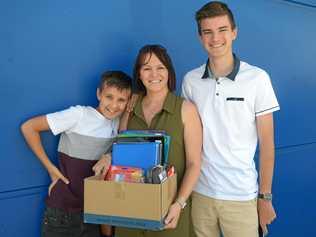 Jack, Jo and Tom Kavanagh join the crowds at Officeworks in preparation for a new school year. Picture: Jann Houley