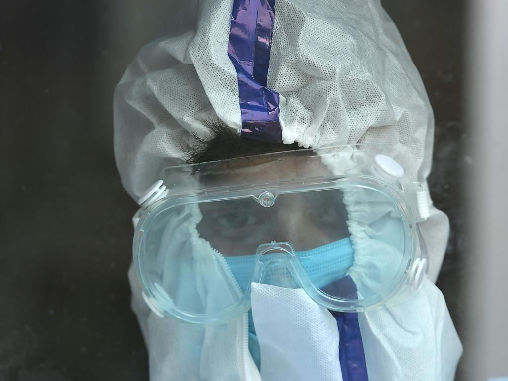 A health worker wearing a protective suit in Srinagar. Picture: TAUSEEF MUSTAFA / AFP