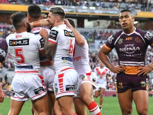 Tim Lafai celebrates scoring a try with his Dragons teammates against the Broncos at Suncorp Stadium. Picture: AAP