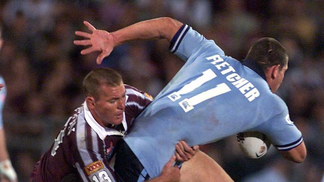 Campion tackles NSW’s Bryan Fletcher in the 2001 State of Origin series-opener. Picture: Mark Evans