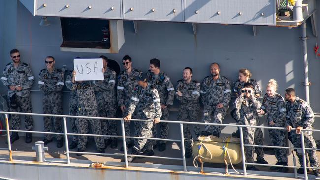 Sailors aboard the Royal Australian Navy frigate HMAS Ballarat (FFH 155) send friendly messages to US sailors and marines aboard the forward-deployed amphibious assault ship USS America (LHA 6) during a fuelling-at-sea between the two ships as part of Exercise Talisman Sabre 2021. Australian and US Forces combine biannually for Talisman Sabre, a month-long multi-domain exercise that strengthens allied and partner capabilities to respond to the full range of Indo-Pacific security concerns. Picture: Mass Communication Specialist 2nd Class Shelby M. Tucker/US Navy