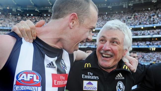 Mick Malthouse celebrates the 2010 premiership with former Pies skipper Nick Maxwell.