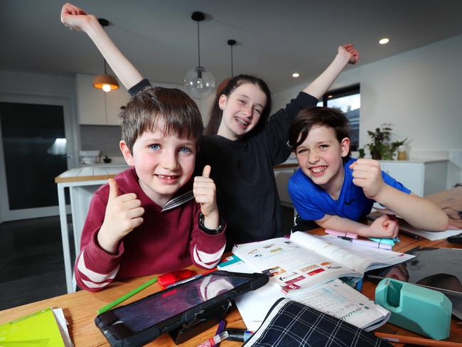 Victorian school kids Jude 6, Jasmine 13 and Elijah 10 are very happy with Victoria’s results at Blackburn North. Picture: Rebecca Michael