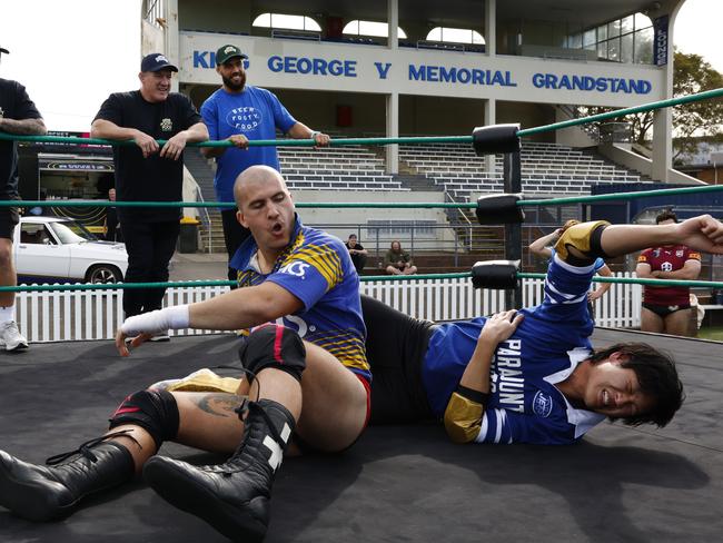 A couple of NRL stars watch wrestling at Henson Park. Picture: Jonathan Ng