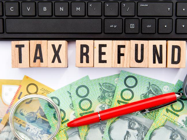 Tax Refund - Australia - wooden letters with keyboard, money and calculator, generic