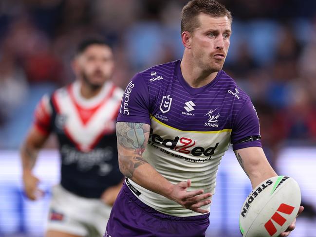 SYDNEY, AUSTRALIA - APRIL 18:  Cameron Munster of the Storm looks to pass the ball during the round seven NRL match between Sydney Roosters and Melbourne Storm at Allianz Stadium on April 18, 2024, in Sydney, Australia. (Photo by Cameron Spencer/Getty Images)