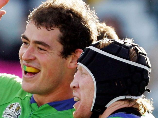 Terry Campese celebrates another try with captain Alan Tongue (13) during Canberra Raiders v Penrith Panthers NRL match at Canberra Stadium in Canberra.