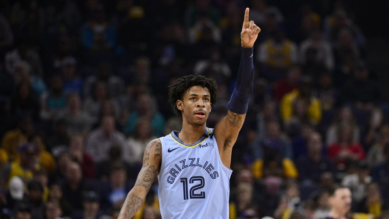 Memphis Grizzlies guard Ja Morant (12) gestures in the first half of an NBA basketball game against the Los Angeles Lakers, Saturday, Feb. 29, 2020, in Memphis, Tenn. (AP Photo/Brandon Dill)