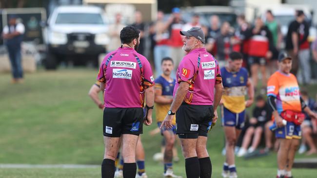 Referees consult after some push and shove. Picture: DC Sports Photography