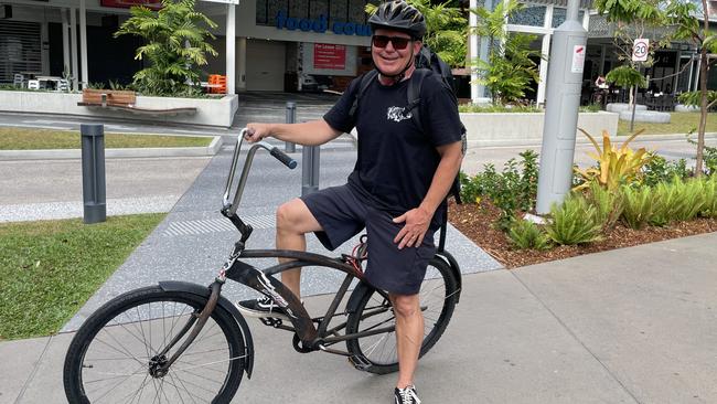 Eric Fisher has been riding his retro cruiser to work in Cairns for about 13 years and said it's enjoyable in all weather. Picture: Alison Paterson