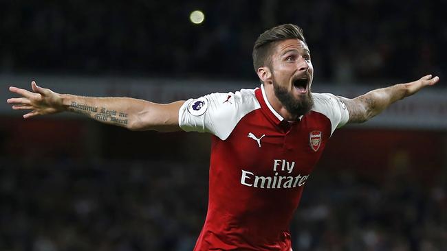 Arsenal's French striker Olivier Giroud celebrates scoring Arsenal's fourth goal during the English Premier League football match between Arsenal and Leicester City at the Emirates Stadium in London on August 11, 2017. / AFP PHOTO / Ian KINGTON / RESTRICTED TO EDITORIAL USE. No use with unauthorized audio, video, data, fixture lists, club/league logos or 'live' services. Online in-match use limited to 75 images, no video emulation. No use in betting, games or single club/league/player publications.  /