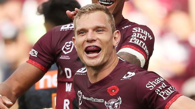 SYDNEY, AUSTRALIA - APRIL 25:  Tom Trbojevic of the Sea Eagles celebrates with team mates after scoring a try during the round seven NRL match between the Wests Tigers and the Manly Sea Eagles at Bankwest Stadium, on April 25, 2021, in Sydney, Australia. (Photo by Matt King/Getty Images)