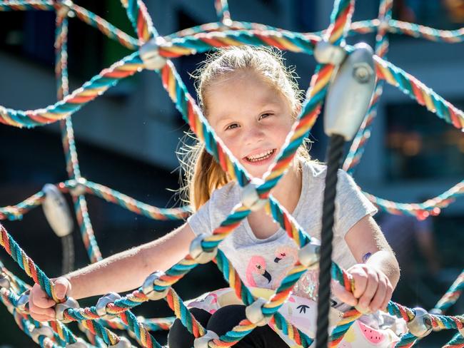 Scarlett Dickson, 4, plays at the RCH playground before being admitted for her fourth open heart surgery. Picture: Jake Nowakowski