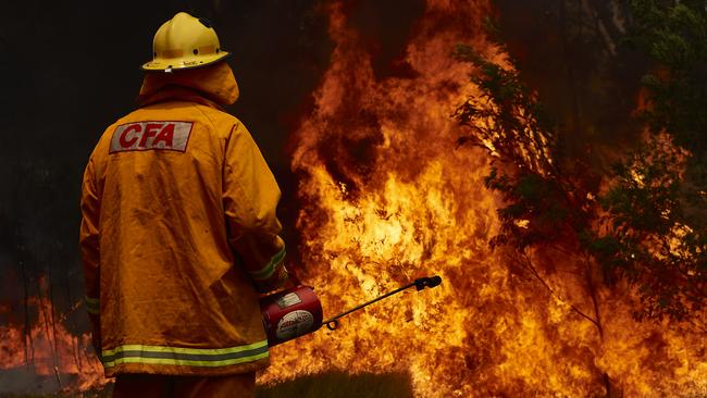 A CFA member works on controlled burn in Sydney, Australia. Picture: Brett Hemmings/Getty