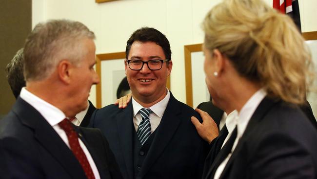 Michael McCormack and George Christensen share a light moment as the Nationals face the media this morning. Picture: Kym Smith