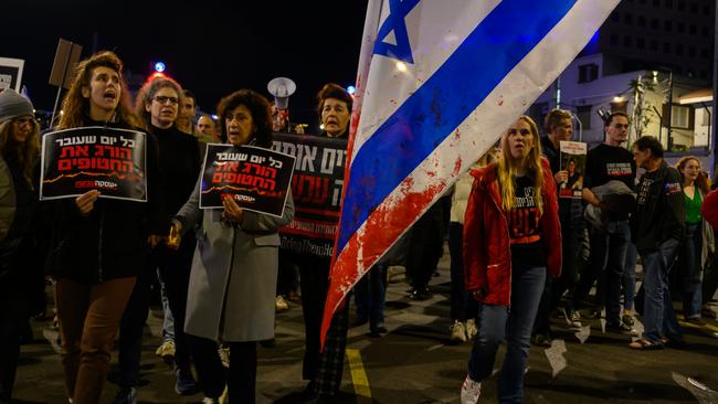 TEL AVIV, ISRAEL - DECEMBER 15: Protesters march through the streets after demonstrating outside the Israel Defense Force headquarters on December 15, 2023 in Tel Aviv, Israel. Earlier today, the IDF said its forces accidentally killed three hostages being held in Gaza when it mistakenly identified them as potential threats. Yotam Haim, Samer Talalka, Alon Shamriz were kidnapped from southern Israel on Oct. 7 by Hamas militants and taken back to the Gaza Strip. Israel launched an air and ground campaign in Gaza soon thereafter in an effort to defeat Hamas. In November, a weeklong ceasefire allowed for the negotiated release of some hostages, but more than 100 remain in captivity. (Photo by Alexi J. Rosenfeld/Getty Images)