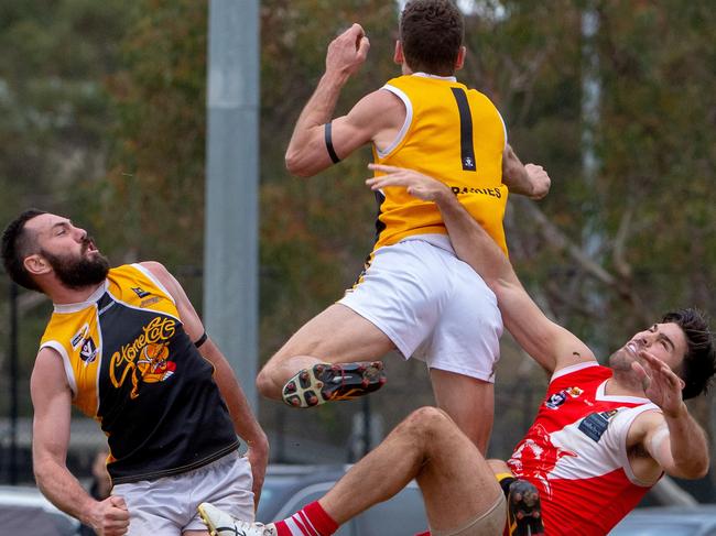 Frankston YCW’s Christian Ongarello (1) and Byron Barry (left) go up against Sorrento's Chris Dawes in a game in 2018. Picture: Jay Town