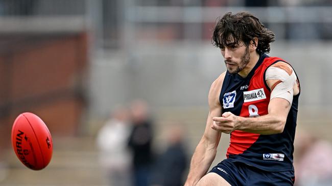Tom Silvestro gets a kick for Coburg. Picture: Andy Brownbill