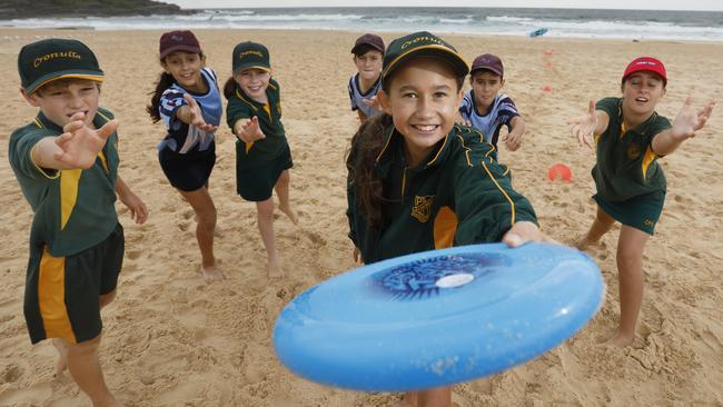 Aria O'Shea, 11, from Cronulla Public School playing Ultimate Frisbee with classmates and pupilss from Brighton Le Sands Public School at Maroubra Beach. Picture: Quentin Jones