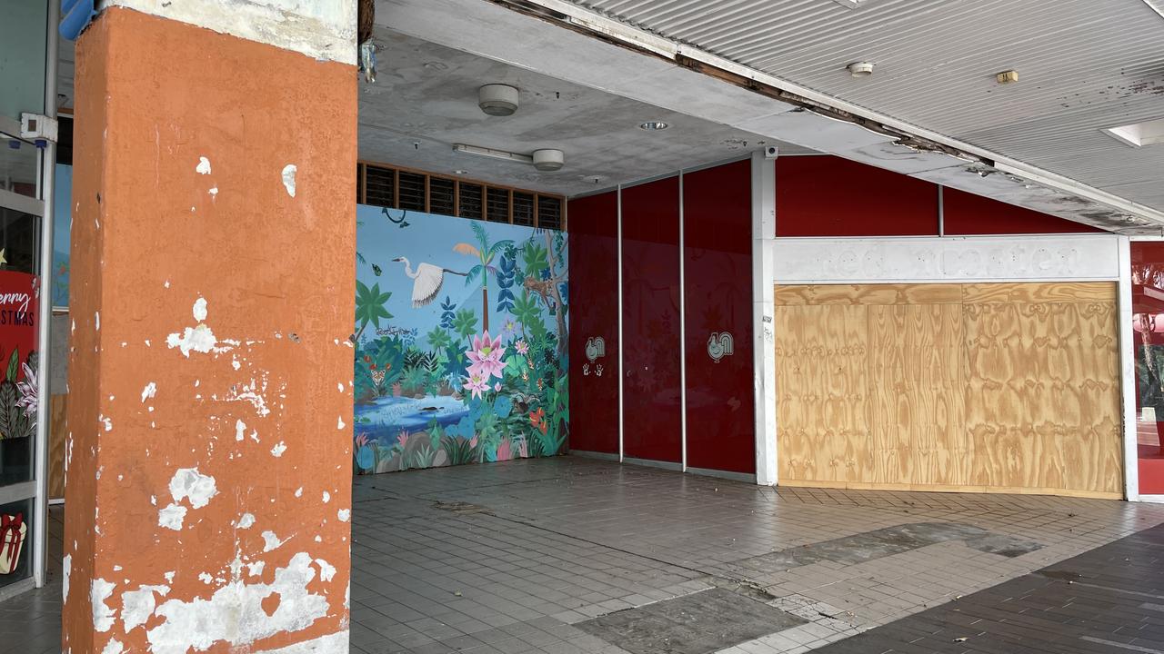 A wrecked roof, graffitied walls, and damaged tiles at the former Dimmeys Arcade greets visitors to the Townsville CBD. Picture: Leighton Smith.