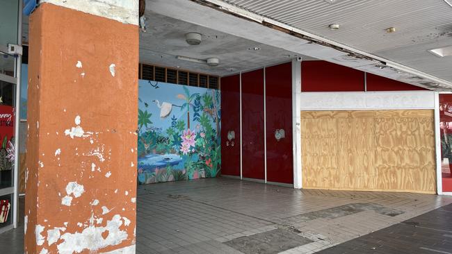 A wrecked roof, graffitied walls, and damaged tiles at the former Dimmeys Arcade greets visitors to the Townsville CBD. Picture: Leighton Smith.