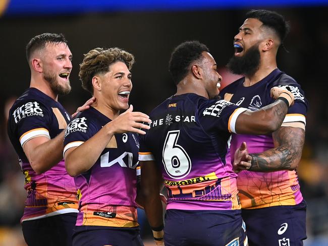 BRISBANE, AUSTRALIA - JULY 27: Ezra Mam of the Broncos celebrates with team mates after scoring a try during the round 22 NRL match between Brisbane Broncos and Sydney Roosters at The Gabba on July 27, 2023 in Brisbane, Australia. (Photo by Albert Perez/Getty Images)