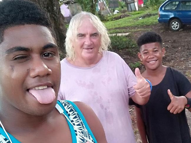 Collingwood supporter Joffa Corfe with children from the Namuavoivoi village in Bua Province, Northern Fiji. Picture: supplied.