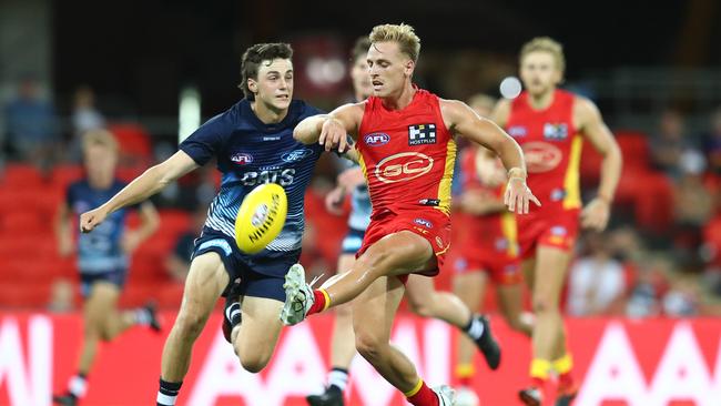 Darcy Macpherson of the Suns kicks during the 2020 Marsh Community AFL Series