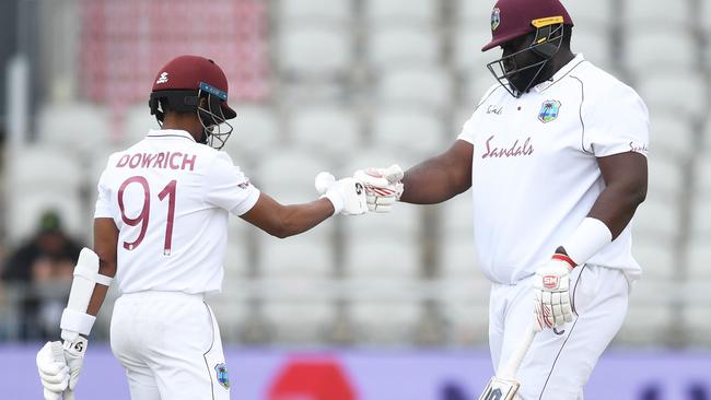 MANCHESTER, ENGLAND - JULY 26: Shane Dowrich and Rahkeem Cornwall of West Indies embrace during Day Three of the Ruth Strauss Foundation Test, the Third Test in the #RaiseTheBat Series match between England and the West Indies at Emirates Old Trafford on July 26, 2020 in Manchester, England. (Photo by Gareth Copley/Getty Images for ECB)