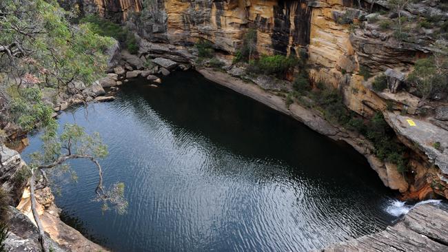 The couple were at the popular swimming hole, Mermaid Pools, when she wandered off in the dark and fell. Picture: Simon Bullard