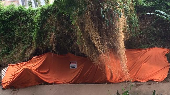 Asbestos covered up at A’Becketts Creek in Granville after last month’s big storm.