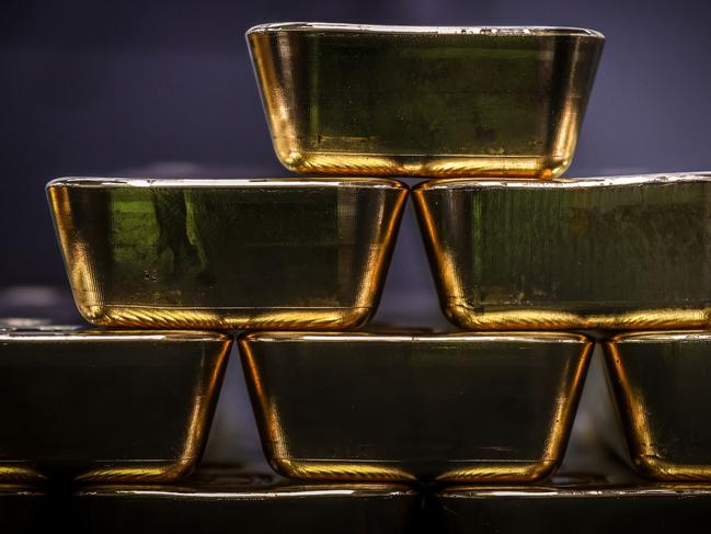 Gold bullion bars are pictured after being inspected and polished at the ABC Refinery in Sydney on August 5, 2020. - Gold prices hit 2,000 USD an ounce on markets for the first time on August 4, the latest surge in a commodity seen as a refuge amid economic uncertainty. (Photo by DAVID GRAY / AFP)