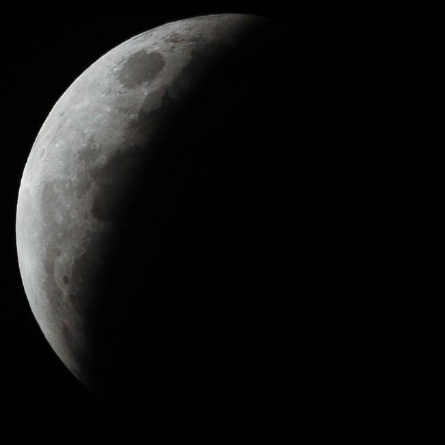 The super blood full moon seen over Darwin on Wednesday night. Pictures: Glenn Campbell