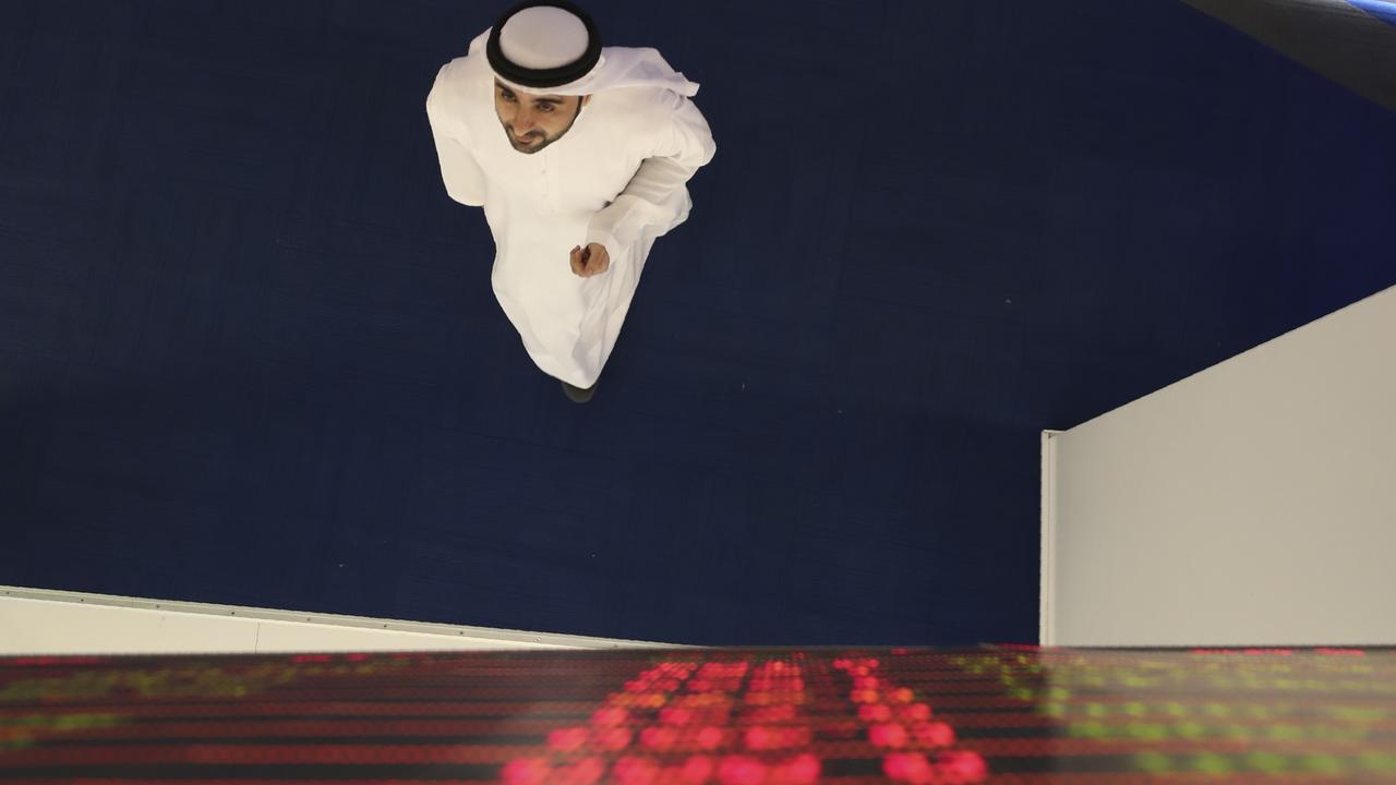 An Emirati trader checks the stocks on the screen at the Dubai Financial Market. Picture: AP Photo/Kamran Jebreili