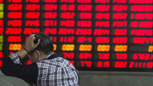 An investor outside a securities exchange house in Shanghai. Picture: Qilai Shen/Bloomberg