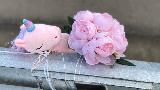 Floral tributes and a small toy unicorn lay at the fatal crash site on Algona Road. Photo: Phil Young