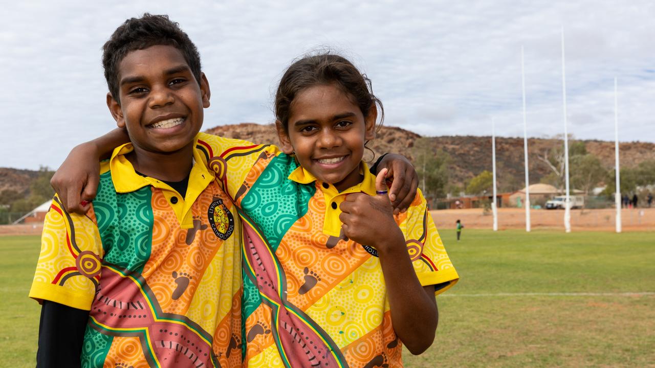 Ashley Smith, 11, and Latahnia Anderson, 10, stand in front of the full length goalposts. Picture: Emma Murray