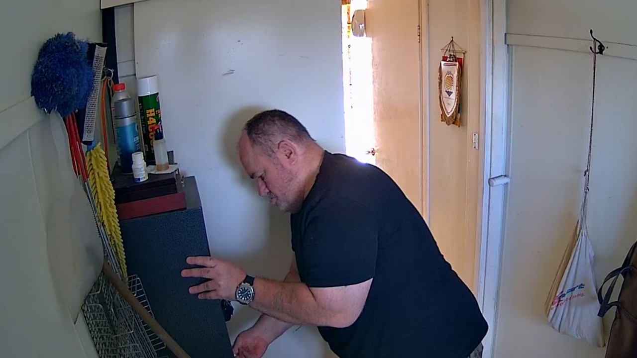 Mr Simon taking the case out of the safe just two days before the murder. Picture: Supplied