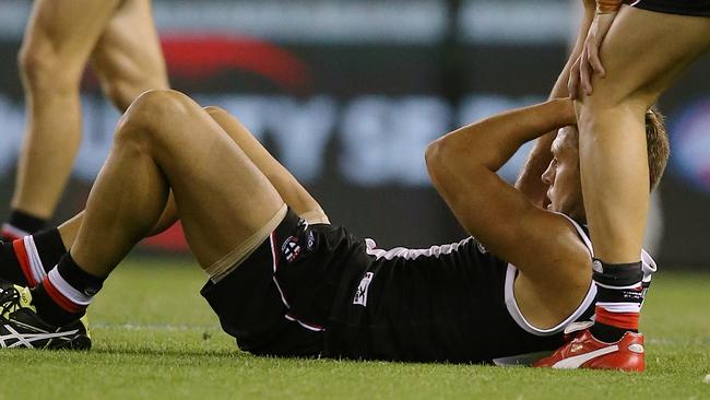 Sean Dempster after being bumped in the head by Nathan Krakouer. Picture: Wayne Ludbey