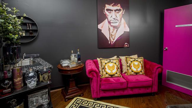 The furniture inside Mr MacCallums office. The Scarface painting is his favourite item. Photo: Jerad Williams