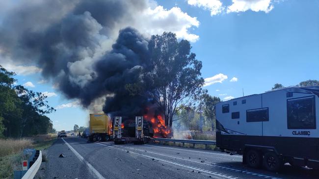 Firey scenes of the Bruce Highway crash at Bajool on Wednesday July 19, involving three trucks, one with an Army tank loaded on the trailer, and four vehicles.