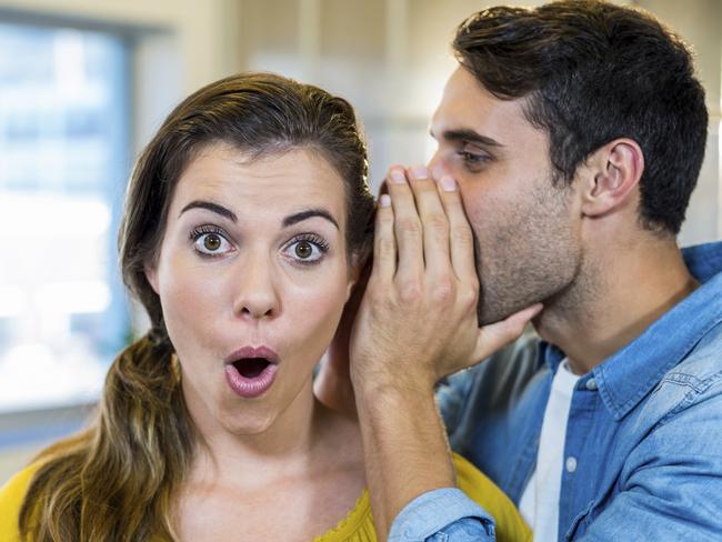 Casual business team whispering in the office