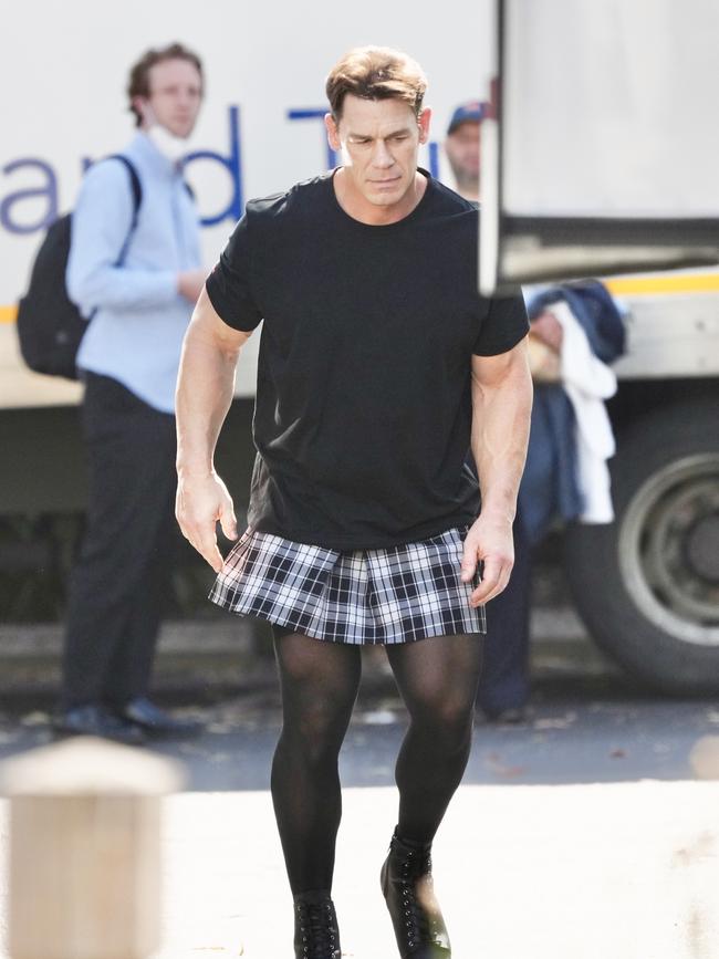 Cena rocked a plaid skirt, heels, and stockings as part of his outfit. Picture: BackGrid