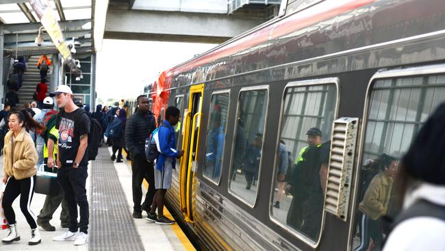 Passengers board a train at Mawson Lakes. Picture: Brenton Edwards.