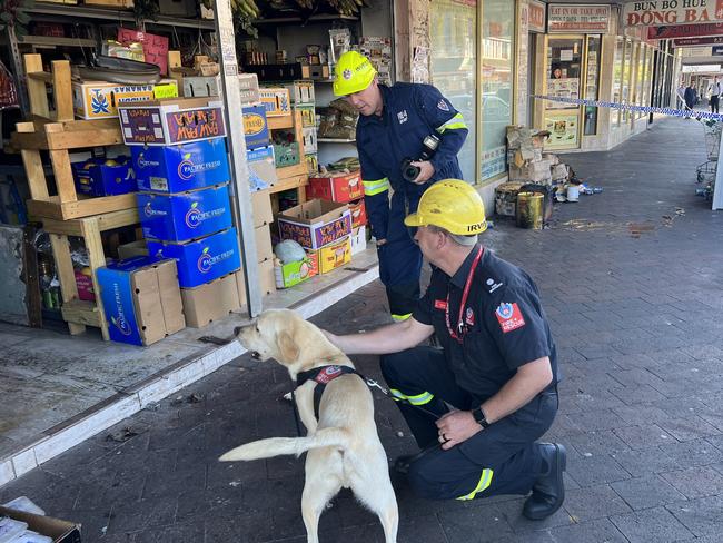 A Cabramatta grocery store was on fire about 3am on March 9, 2023. Pictures of fire investigators at the scene after the blaze was extinguished. Picture: Fire and Rescue NSW