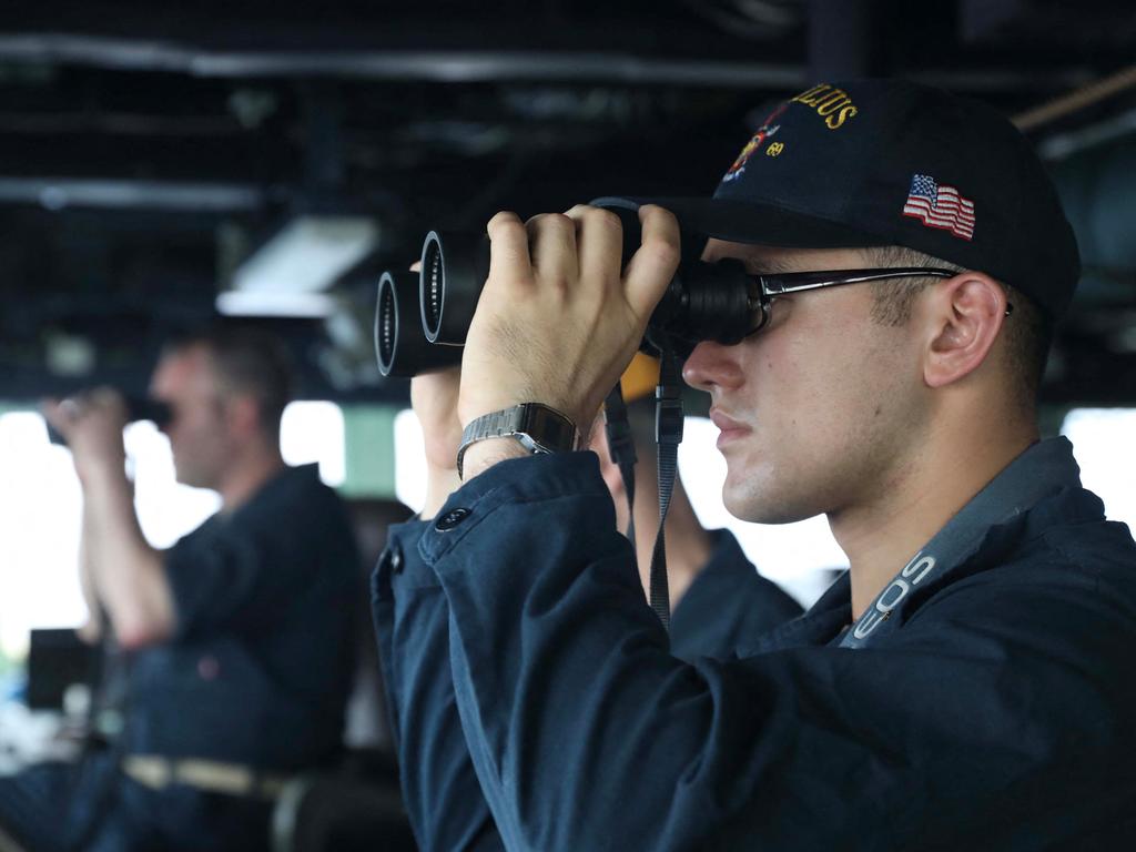 The US 7th Fleet shared images Monday on Twitter of crew looking out into the strait, one of the most crucial waterways in the world for international shipping.