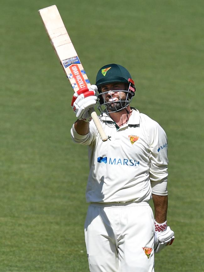 Alex Doolan of the Tigers raises his bat after scoring 100 runs during day four of the Marsh Sheffield Shield match between South Australia and Tasmania at Adelaide Oval in Adelaide, Thursday, November 14, 2019. (AAP Image/David Mariuz)