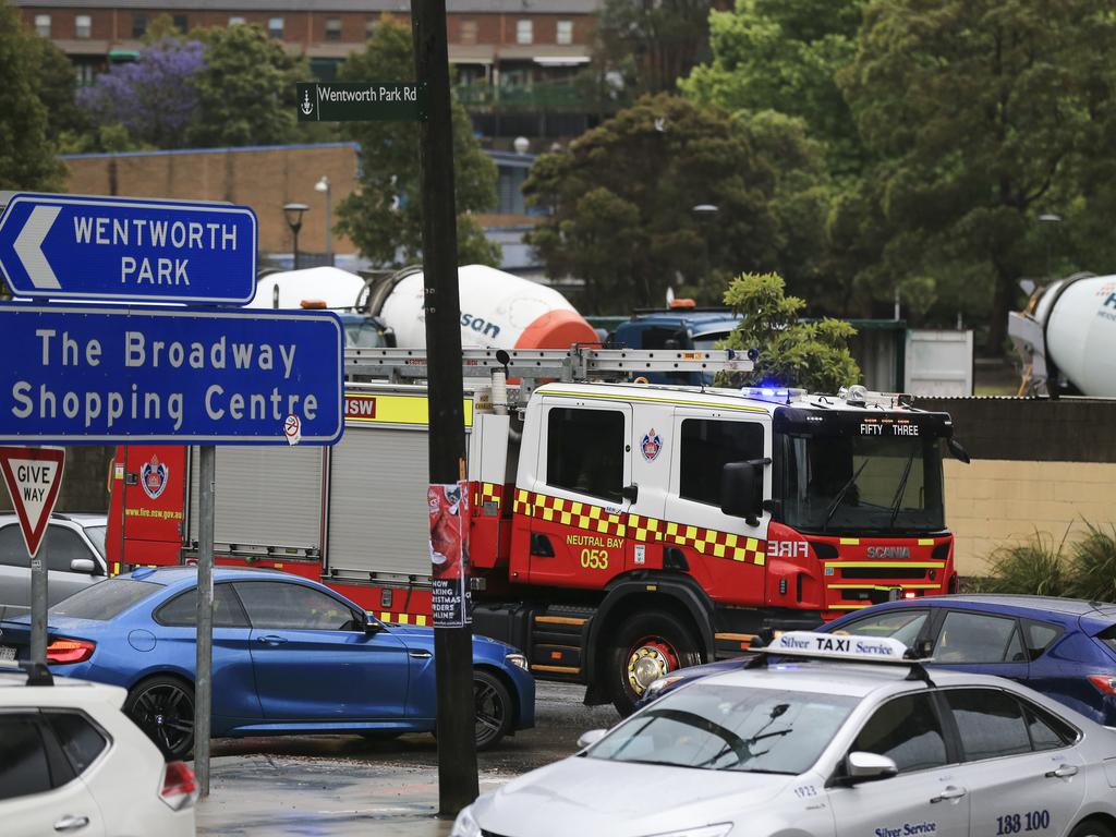 Emergency vehicles on Bridge Road, Glebe. Heavy rain and wind hits as Sydney endures bad weather. Picture: Dylan Robinson