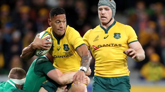 Keith Earles and Garry Ringrose of Ireland tackle Israel Folau of the Wallabies during the Second Test between Australia and Ireland at AAMI Park in Melbourne, Saturday, June 16, 2018. (AAP Image/Mark Dadswell) NO ARCHIVING, EDITORIAL USE ONLY